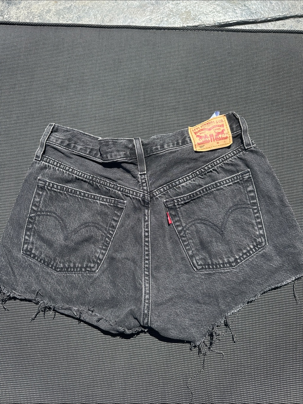 Levi’s Black Denim Cutoff Shorts with Distressed Hem